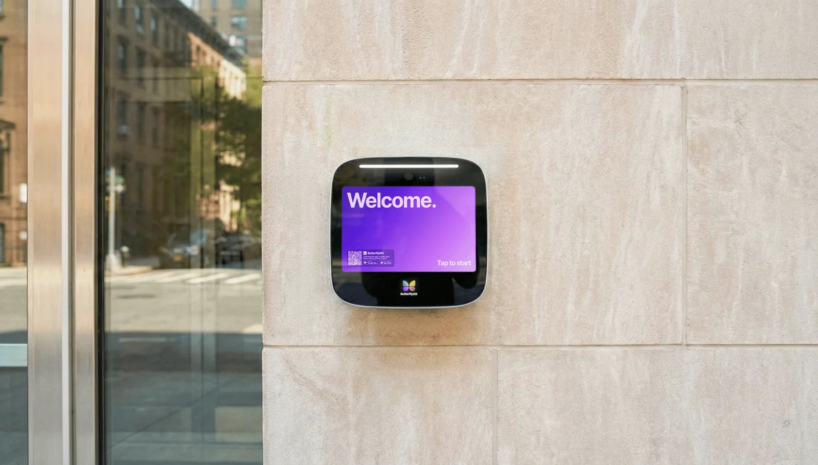 ButterflyMX 12 inch video intercom with a touch screen directory at a building entrance